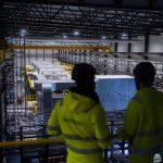 Two workers overlook operations at Northolt's Revolt plant.