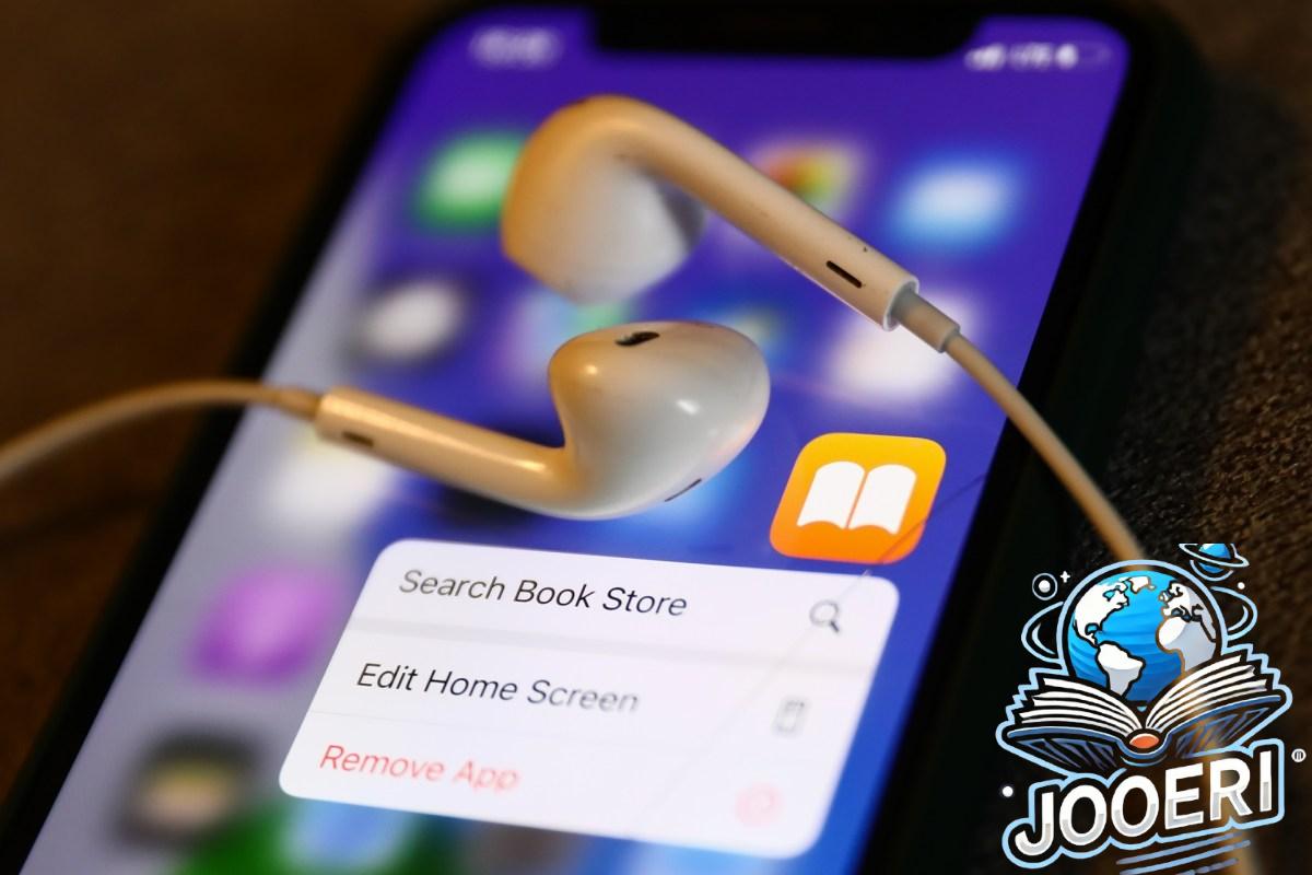 Apple Books icon displayed on a phone with headphones
