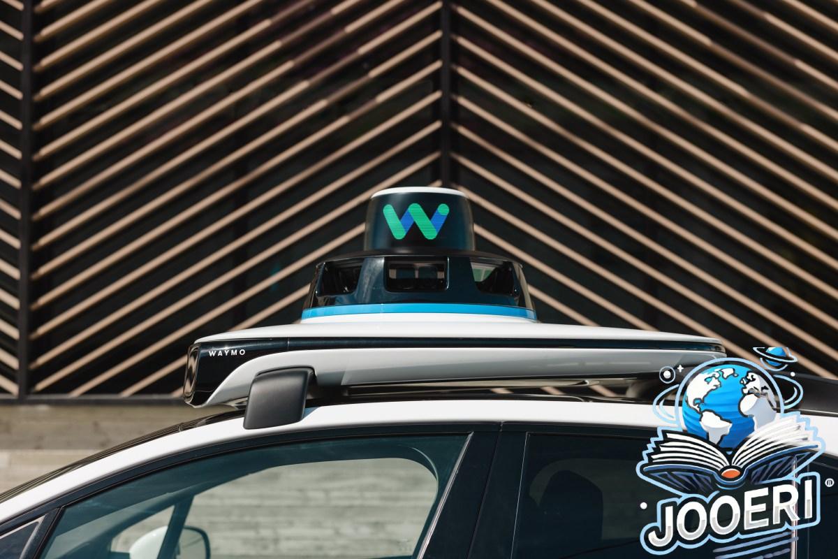 top of Waymo car, showing equipment on roof