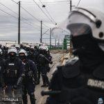 a photo of Serbian police units in riot gear guard the entrance to the Old Sava Bridge in Belgrade on November 20, 2024, during of a protest