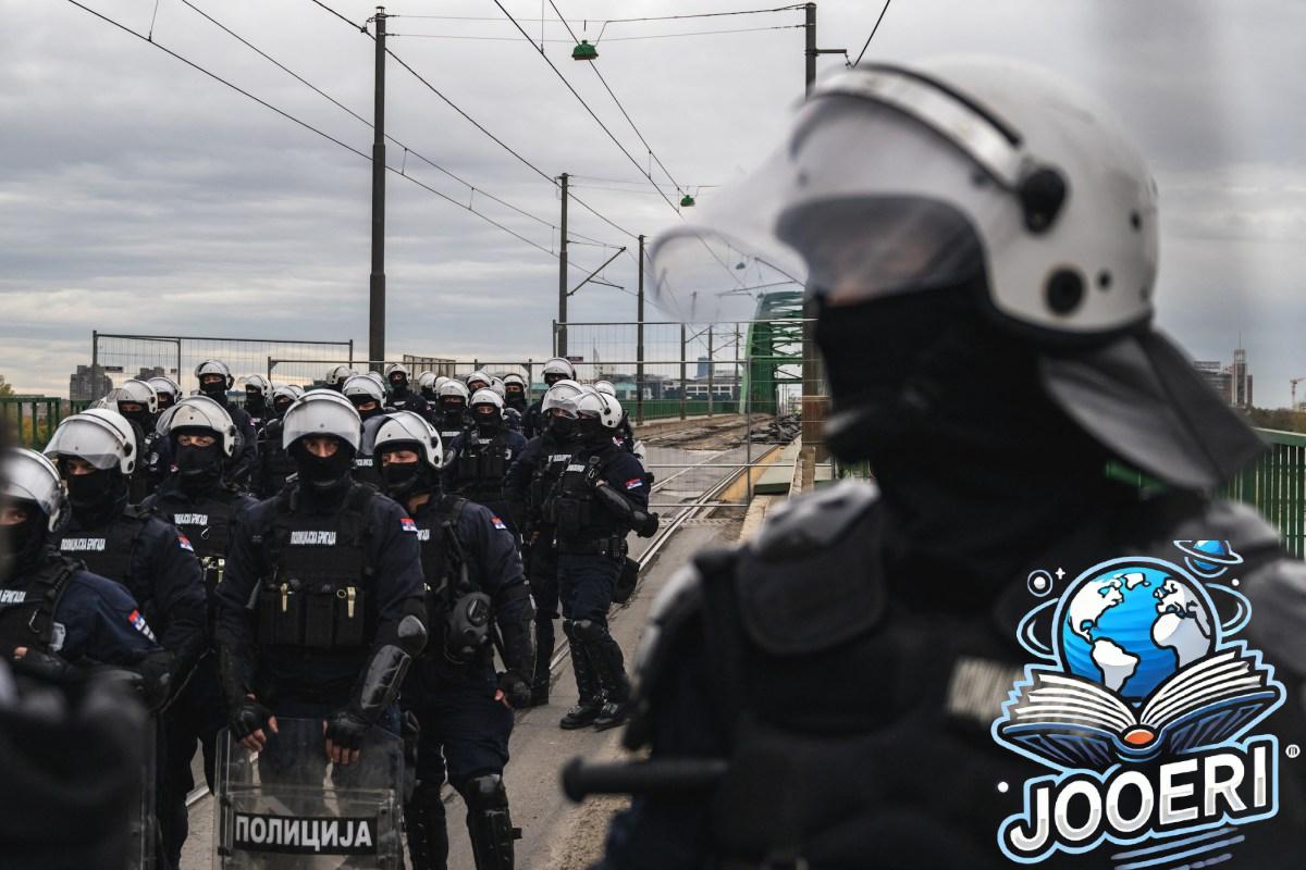 a photo of Serbian police units in riot gear guard the entrance to the Old Sava Bridge in Belgrade on November 20, 2024, during of a protest