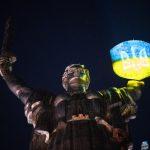 Shield of the statue of the Motherland is illuminated in the colors of the Ukrainian flag during the "Light the Fire" event where 1000 candles are lit on the 1000th day of the full-scale war with Russia at the National Museum of the History of Ukraine in the Second World War in Pechersk district of Kyiv, Ukraine on November 19, 2024.