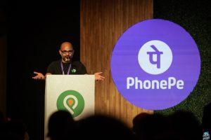 Sameer Nigam at podium with PhonePe logo shown
