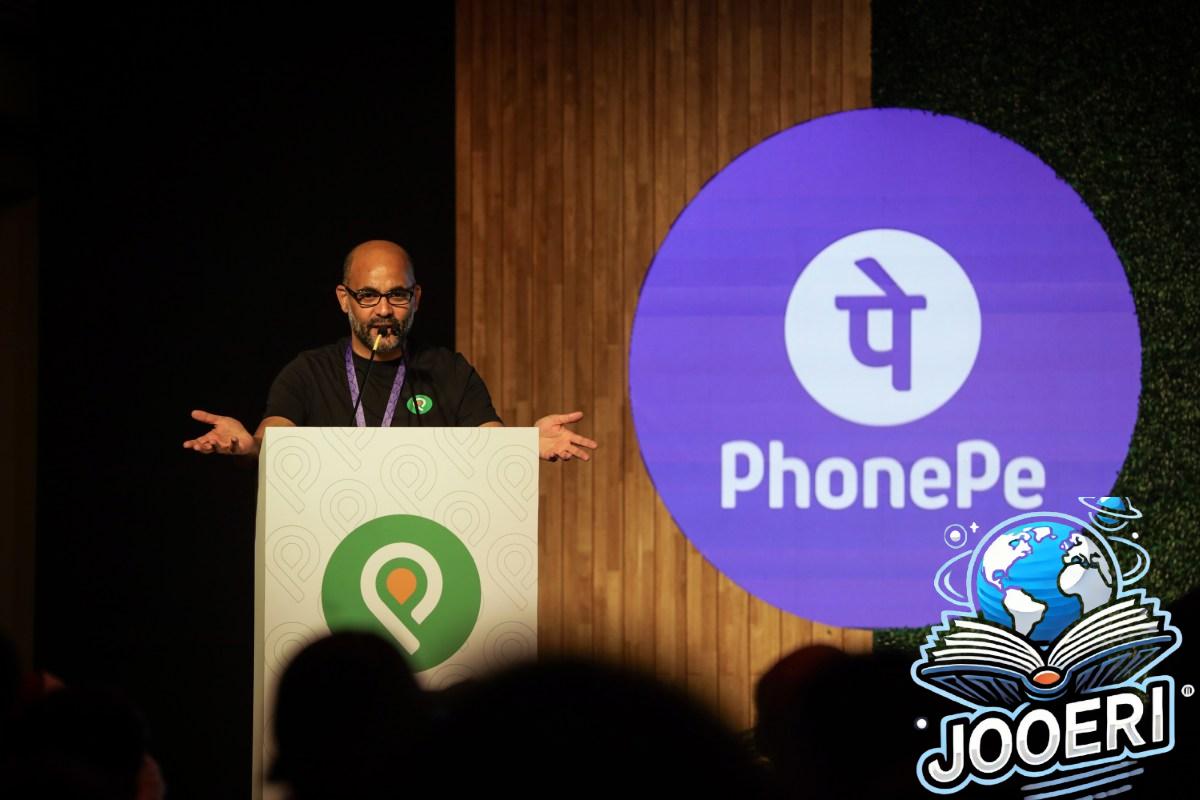 Sameer Nigam at podium with PhonePe logo shown