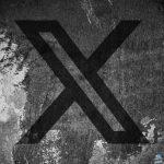 X (formerly Twitter) logo on a cracked wall