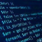 Blue code on a dark background presented at an angle.