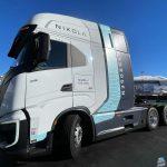 A white, blue and gray Nikola hydrogen-powered truck on display outside at CES 2024 in Las Vegas.